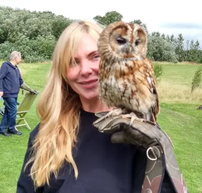 Samantha Janus holding another superstar, Fletcher our fantastic tawny owl (Strix aluca) on a Bird on the Hand falconry experience. Images of our birds of prey.