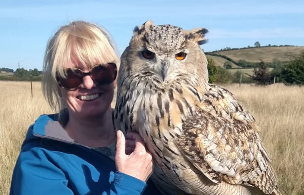 Woman holding priscilla siberian eagle owl close up crop 600 short